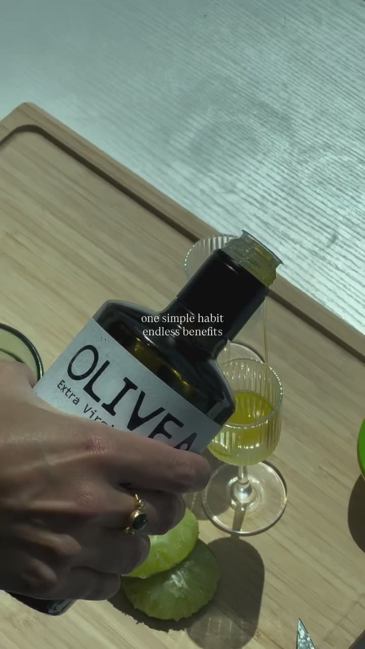 Pouring Olivea HPEVOO into a tasting glass — one simple habit, endless benefits